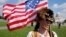 A man wearing a raccoon hat talks about his belief that Donald Trump won the election during a rally in support of defendants being prosecuted in the Jan. 6 attack on the Capitol, in Washington, Sept. 18, 2021. 