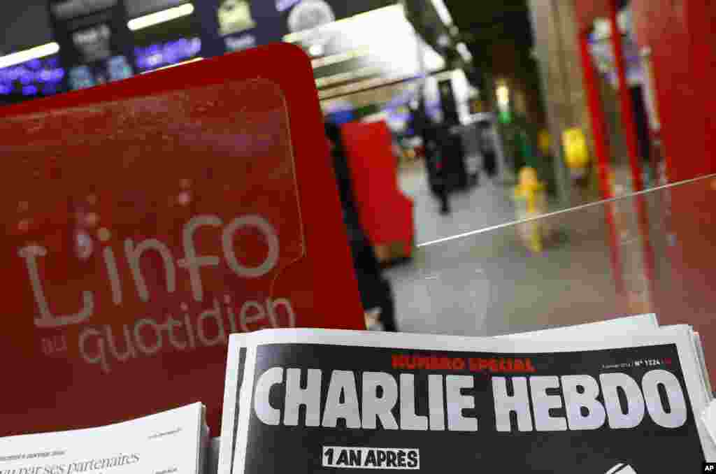 A special edition of the satirical newspaper Charlie Hebdo on a newsstand Wednesday, Jan. 6, 2016 at a train station in Paris.