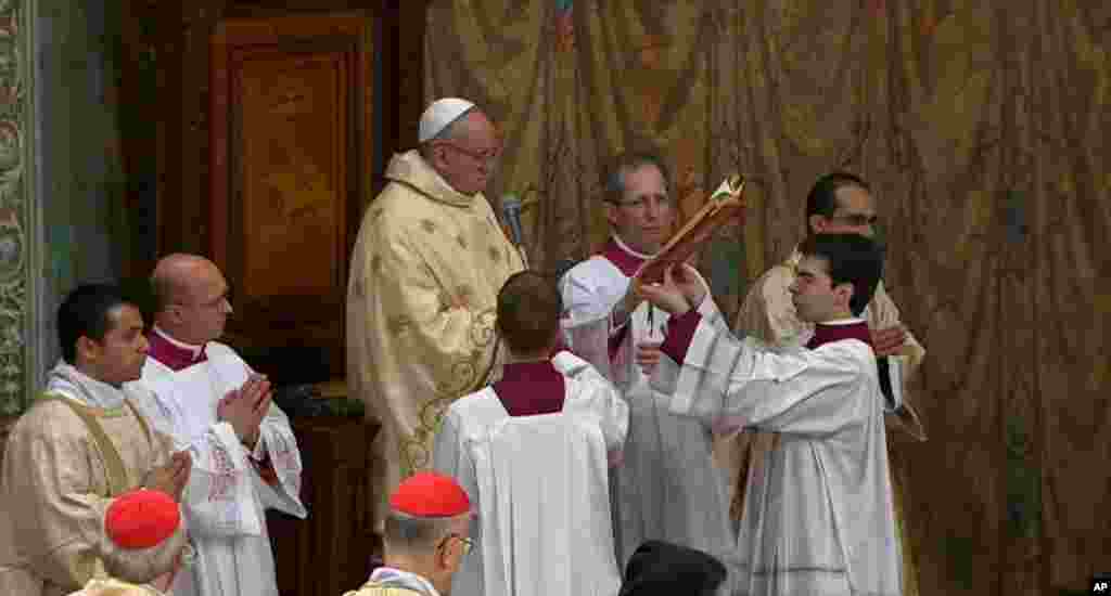 In this image made from video provided by CTV, Pope Francis celebrates his inaugural Mass with cardinals, inside the Sistine Chapel, at the Vatican, March 14, 2013. 