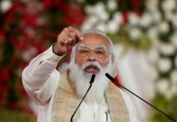 FILE PHOTO: India's Prime Minister Narendra Modi addresses a gathering in Ahmedabad, India, March 12, 2021.
