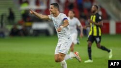 Nassr's Portuguese forward #07 Cristiano Ronaldo celebrates his second goal during the Saudi Pro League football match between Al-Ittihad and Al-Nassr at King Abdullah Sports City Stadium in Jeddah on December 26, 2023. (Photo by AFP)