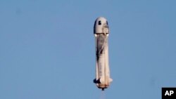 Blue Origin's New Shepard rocket launches carrying TV celebrity and former NFL football great Michael Strahan along with other passengers from its spaceport near Van Horn, Texas, Dec. 11, 2021.