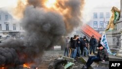 FILE - A farmer protest action in the European district in Brussels, organized by general farmers union ABS (Algemeen Boerensyndicaat) to demand better conditions to grow, produce and maintain a proper income, on the day of a European Council meeting on Feb. 1, 2024. 