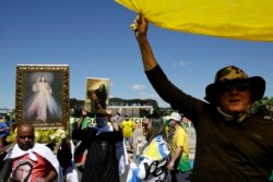 FILE - Supporters of Brazil's President Jair Bolsonaro shout slogans during a protest against his former Minister of Justice Sergio Moro and the Supreme Court, in front of the Planalto presidential palace, in Brasilia, Brazil, May 3, 2020.