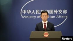 FILE - Chinese Foreign Ministry spokesperson Guo Jiakun conducts a press conference, in Beijing, Jan. 7, 2025. Beijing would like China-U.S. relations "to make greater progress from a new starting point,” Guo said on Jan. 21, 2025.