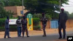 Army soldiers patrol outside the prison after unidentified gunmen attacked the central prison in capital city Niamey, Niger, June 1 2013.
