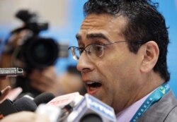 FILE - Macau lawmaker and member of the election committee, Jose Coutinho, speaks to the media, July 26, 2009.