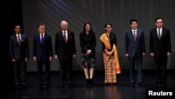 FILE - Japan's Prime Minister Shinzo Abe stands for photo with fellow Southeast Asian leaders at the 31st ASEAN Summit, in Manila, Philippines, Nov. 13, 2017. 