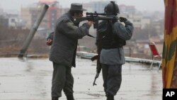 Police soldiers guard during celebrations of Nowruz, the Persian new year, at the Kart-e-Sakhi shrine in Kabul, Afghanistan, March 21, 2017. 