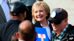 Democratic presidential candidate Hillary Rodham Clinton speaks with members of the audience, Oct. 7, 2015, during a campaign stop at the Westfair Amphitheater in Council Bluffs, Iowa.