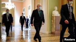 FILE - Senate Majority Leader Mitch McConnell (R-KY) walks to the Senate Chamber on Capitol Hill in Washington, Sept. 30, 2020. 