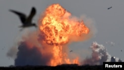 The SpaceX Starship SN9 explodes into a fireball after its high altitude test flight from test facilities in Boca Chica, Texas, U.S. February 2, 2021. REUTERS/Gene Blevins TPX IMAGES OF THE DAY