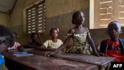FILE - Children attend class at a school in Segou, Mali, Oct 1, 2019.