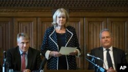 Dame Cheryl Gillan with Charles Walker (L) and Bob Blackman (R) read out the results of the first ballot in the Tory leadership ballot at the Houses of Parliament in Westminster, London, June 13, 2019.