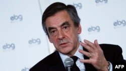 French presidential election candidate for the right-wing Les Republicains (LR) party Francois Fillon gestures as he speaks during a debate organized by the EBG (Electronic Business Group), Jan. 31, 2017, in Paris.