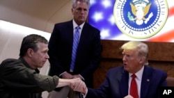 President Donald Trump participates in a briefing with North Carolina Gov. Roy Cooper about Hurricane Dorian at Marine Corps Air Station Cherry Point, Monday, Sept. 9, 2019, in Havelock, N.C., aboard Air Force One.
