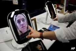 The HiMirror Mini, an internet-connected smart mirror with Amazon's Alexa, is displayed during CES Unveiled at CES International Sunday, Jan. 7, 2018, in Las Vegas. (AP Photo/Jae C. Hong)