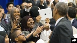President Barack Obama greets Al-Rahmah schoolchildren and other guests while visiting the Islamic Society of Baltimore in Maryland, Feb. 3, 2016.
