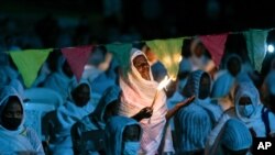 Ethiopian Orthodox Christians light candles and pray for peace during a church service at the Medhane Alem Cathedral in the Bole Medhanealem area of the capital Addis Ababa, Ethiopia, November 5, 2020.