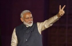 Indian Prime Minister Narendra Modi gestures toward his supporters after the election results at Bharatiya Janata Party (BJP) headquarters in New Delhi, May 23, 2019.