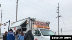The Salvation Army hands out hot meals in Chicago.