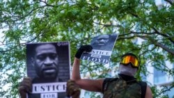 George Floyd protesters set Minneapolis police station afire
