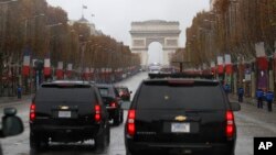 The motorcade of President Donald Trump drives up the Champs Elysees to an Armistice Day Centennial Commemoration at the Arc de Triomphe, Nov. 11, 2018, in Paris.