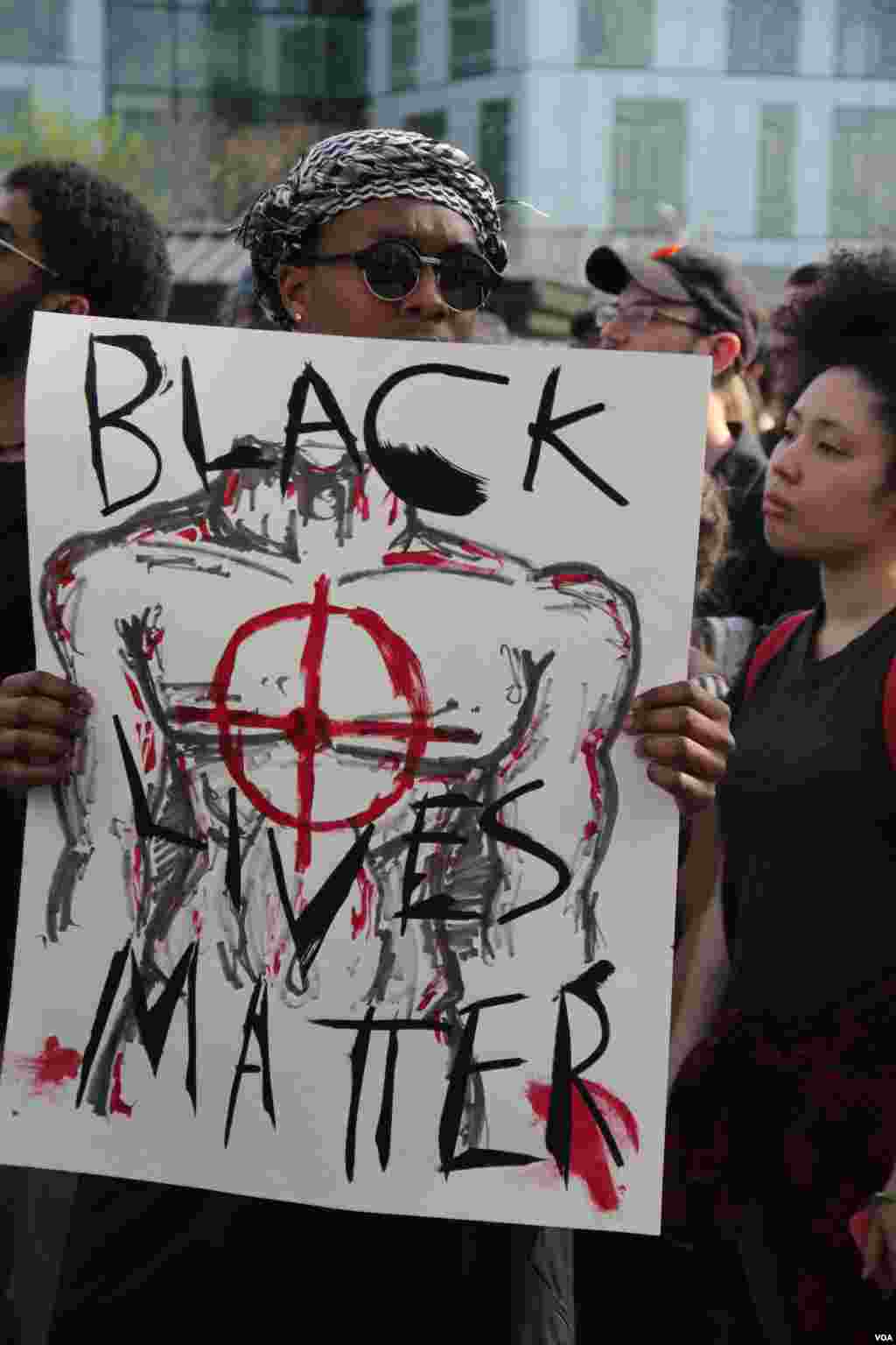A protester among the 1000 high school and college student who marched through Baltimore, Wednesday, April 30, 2015. (Victoria Macchi/VOA News)