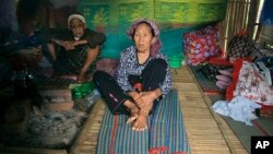 Ethnic Kachin Nlam Numrang Doi, 92, sits along with her husband Hkaraw Yaw, 102, at their hut in compound of Trinity Baptist Church refugee camp for internally displaced people in Myitkyina, Kachin State, northern Myanmar, May 6, 2018.
