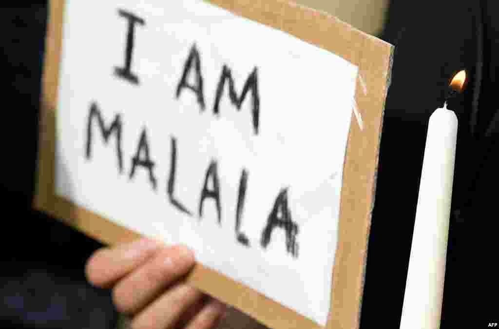 A candle is lit during a vigil for Pakistani girl Malala Yousafzai in Birmingham in central England, October 18, 2012.