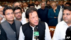 In this photo released by the National Assembly, the leader of Pakistan Tahreek-e-Insaf party Imran Khan,speaks at the National Assembly in Islamabad, Pakistan, Aug. 17, 2018.