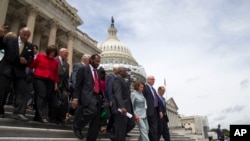 FILE - House Minority Leader Rep. Nancy Pelosi of California leads House Democrats down the steps of the Capitol building in Washington, June 23, 2016.