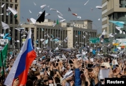 People release paper planes, symbol of the Telegram messenger, during a rally in protest against court decision to block the messenger because it violated Russian regulations, in Moscow, Russia, April 30, 2018.