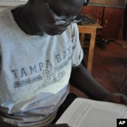 Esther Bagirasas, who plays the queen, learning her lines, Juba, South Sudan, April 4, 2012.