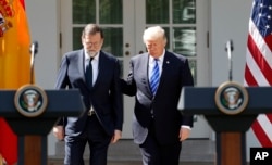 President Donald Trump arrives for a news conference with Spanish Prime Minister Mariano Rajoy in the Rose Garden of the White House in Washington, Sept. 26, 2017.