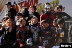 Fans in costumes go to the opening of the movie “Ant-Man and the Wasp” in Los Angeles, California, U.S., 2018.