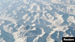 FILE - The Brooks Range spreads out to the horizon in northern Alaska, March 17, 2011. A magnitude 6.4 earthquake shook the area Sunday morning.