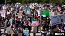 Supporters of reproductive choice rally at Freedom Plaza before marching to the U.S. Supreme Court during the nationwide Women's March, in Washington, Oct. 2, 2021.