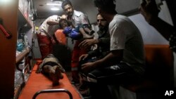 Palestinian medics evacuate wounded children during an Israeli bombardment of the Gaza Strip by ambulance to a hospital in Rafah early May 4, 2024.