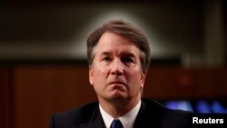 FILE - U.S. Supreme Court nominee Judge Brett Kavanaugh listens during his U.S. Senate Judiciary Committee confirmation hearing on Capitol Hill in Washington, Sept. 4, 2018.