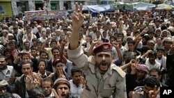 A former army officer, who defected to join anti-government protesters, shouts slogans during a rally demanding the ouster of Yemen's President Ali Abdullah Saleh in Sana'a October 4, 2011.