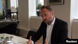 FILE - Denmark's Climate and Energy Minister Dan Jorgensen speaks during an interview in Copenhagen, Denmark, Aug.16, 2019.