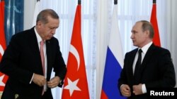 FILE - Russian President Vladimir Putin (R) and Turkish President Recep Tayyip Erdogan attend a news conference following their meeting in St. Petersburg, Russia, Aug. 9, 2016. Both men are scheduled to meet in Moscow Friday.