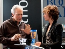 Director CLINT EASTWOOD and CÉCILE de FRANCE on the set of Warner Bros. Pictures’ drama “HEREAFTER,” a Warner Bros. Pictures release.