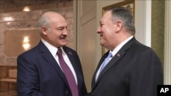 Belarusian President Alexander Lukashenko, left, greets U.S. Secretary of State Mike Pompeo during their meeting in Minsk, Belarus, Feb. 1, 2020. 