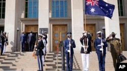 Defense Secretary Lloyd Austin stands with Australian Minister of Defense Peter Dutton during a ceremony at the Pentagon in Washington, Sept. 15, 2021.