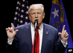 Republican presidential candidate Donald Trump speaks at a rally Sunday, Oct. 30, 2016, in Las Vegas.