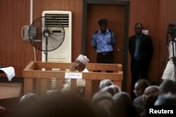 FILE - Nigeria's Senate President Bukola Saraki looks from the dock at the Code of Conduct Tribunal at Darki Biu, Jabi Abuja, Nigeria, Sept. 22, 2015.