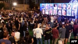 Survivors, friends and relatives attend a memorial for the victims killed at or kidnapped from the Supernova music festival during the October 7 attacks by Palestinian militants, on the eve of the attacks' first anniversary in Tel Aviv on October 6, 2024.