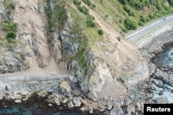 Landslides block State Highway One near Kaikoura on the upper east coast of New Zealand's South Island following an earthquake, Nov. 14, 2016.